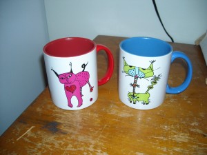 Mugs with creature drawings by Sarah Leavitt